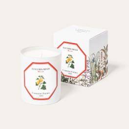 White candle in a glass jar with matching box