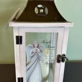 Decorative memorial lantern with an angel illustration and sympathy message