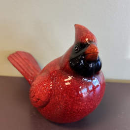 Red decorative bird figurine with a glossy finish