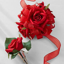 Red rose boutonniere and matching rose corsage with ribbon