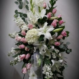 Tall standing floral spray with white lilies and pink roses