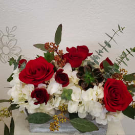 Red roses and white hydrangeas in a rectangular container