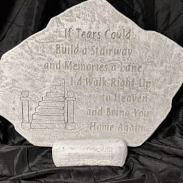 Memorial stone with engraved staircase and verse on a stand