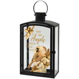 Black lantern with a gold bird and angel memorial card inside