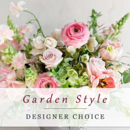 Pink and white mixed flower arrangement in a gray vase