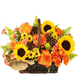 Basket arrangement of orange roses and yellow sunflowers