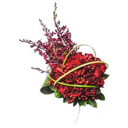 Red rose bouquet with berry accents and looping green ribbon