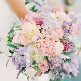 Pastel bouquet of roses, peonies, and lavender flowers