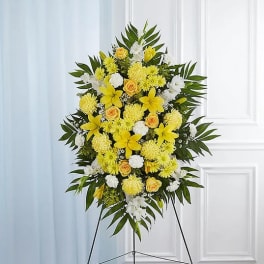 Yellow and white floral standing spray on an easel