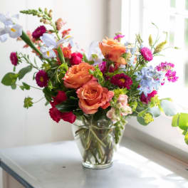 Colorful mixed bouquet in a clear glass vase