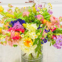 Colorful mixed bouquet in a clear glass vase