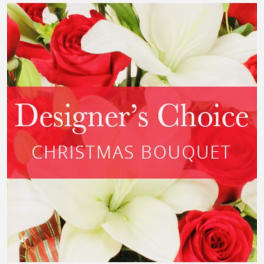Red roses and white lilies with a Christmas bouquet label