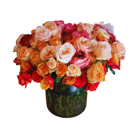 Bouquet of multicolored roses in a glass vase