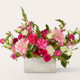 Pink and white mixed flower arrangement in a rectangular wooden box