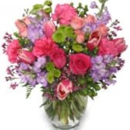 Pink and purple mixed bouquet in a clear glass vase