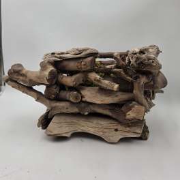 Stacked driftwood planter with small moss accents