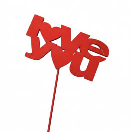 Red "love" pick on a stick against a white background