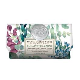 Wrapped bar of eucalyptus and mint soap with floral packaging