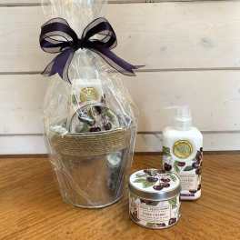 Gift set with cherry-scented lotion, candle, and a wrapped basket