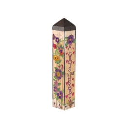 Decorative wooden memorial stake with painted flowers and hearts
