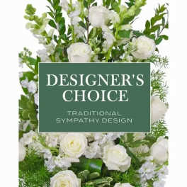 White floral sympathy arrangement with roses and mixed blooms