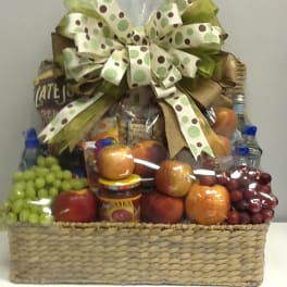 Fruit and snack gift basket with a large polka-dot bow