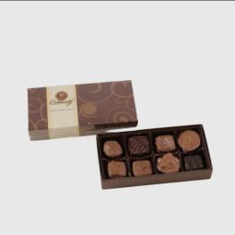 Open box of assorted chocolates with a matching lid