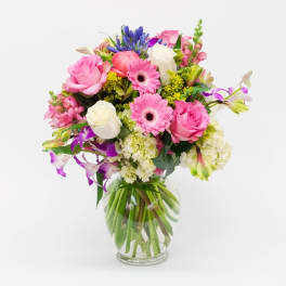 Pink and white mixed bouquet in a clear glass vase