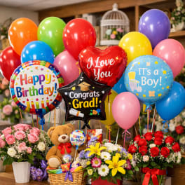 Balloon bouquet with flower arrangements and a teddy bear gift basket