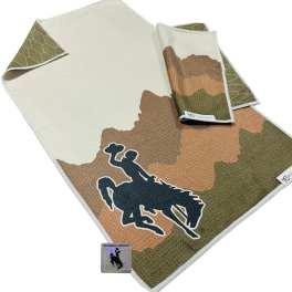 Camouflage blanket with a cowboy silhouette and folded matching cloths