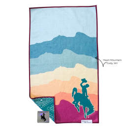Colorful towel with mountain stripes and a cowboy rider silhouette