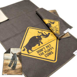 Dark pet mat with a yellow warning graphic and a folded matching mat