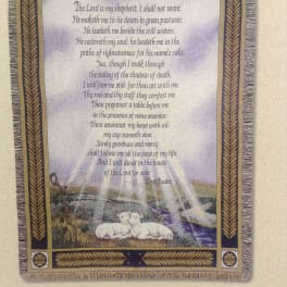 Framed tapestry with Psalm 23 text and two lambs at the bottom