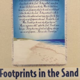 Beach-themed blanket with the poem "Footprints in the Sand"