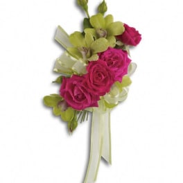 Pink rose corsage with green orchids and ribbon