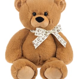 Brown teddy bear with a heart-patterned ribbon bow