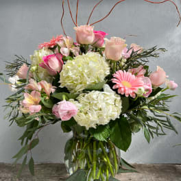 Pink and white mixed bouquet in a glass vase