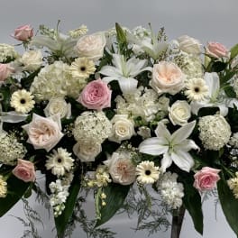Large white and pink floral spray with roses and lilies