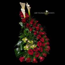 Tall arrangement of red roses and white calla lilies