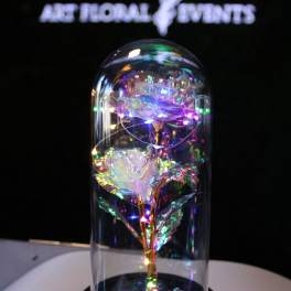 Iridescent decorative roses under a glass dome on a black base