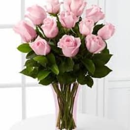 Bouquet of pink roses in a clear glass vase