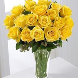 Bouquet of yellow roses in a clear glass vase
