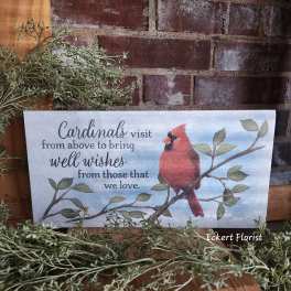 Decorative sign with a cardinal and a well-wishes message