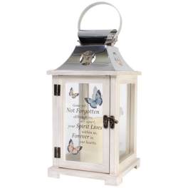 Decorative white lantern with butterfly accents and a memorial message