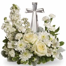 White rose and mum arrangement with a clear crystal cross in the center