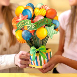 Birthday balloon bouquet in a striped gift box