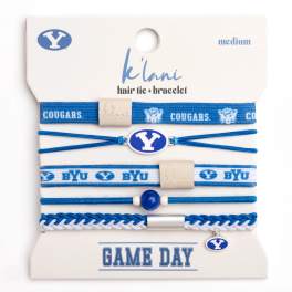 Packaged BYU hair ties and bracelets in blue and white.