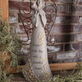 Decorative angel figurine with a gratitude message and wire wings