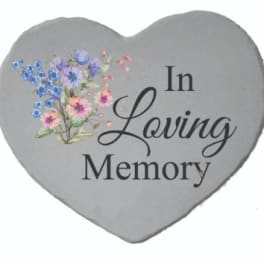Heart-shaped memorial plaque with floral print and the words In Loving Memory