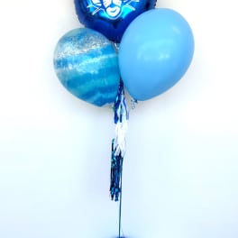 Blue balloon bouquet with a BYU mascot balloon on a weighted base